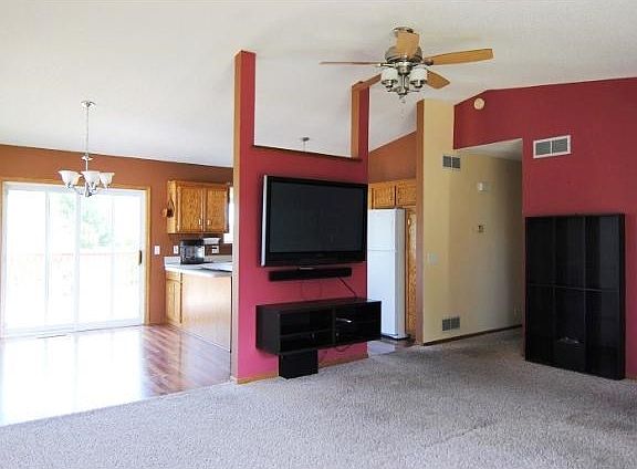 Nice open layout on the upper level.  Walk out to a large deck for entertaining, vaults, and upper level family room complete this space.