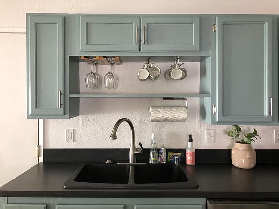 Deep basin sink with long nozzle faucet and powerful food waste disposal make food prep and cleaning easy. Wine coffee and paper towels make food prep easier still.