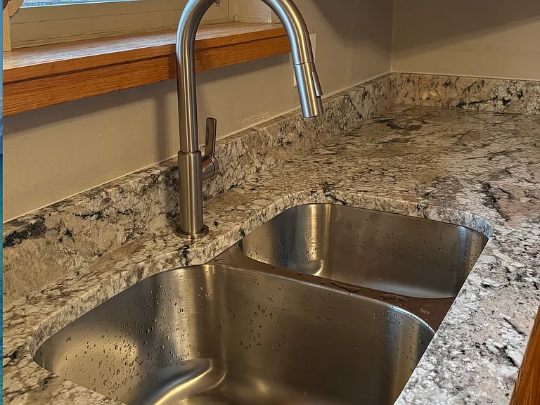 New granite countertops, sink & faucet