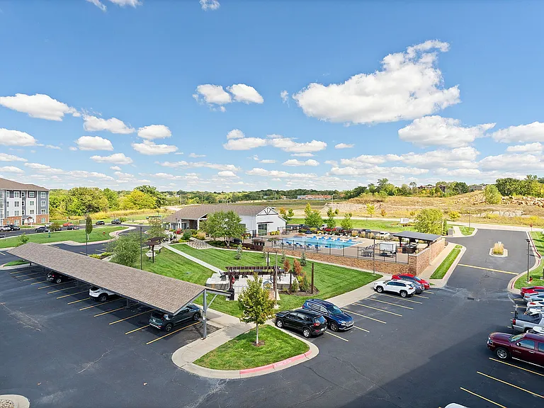 Our community amenities provide plenty of room to relax, including our outdoor lounge, green spaces, and the pool.