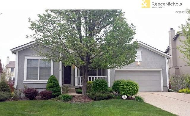 Well cared for home sits on level fenced, nicely landscaped lot.
