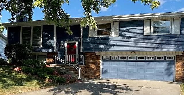 Front View: Lower level double car garage.