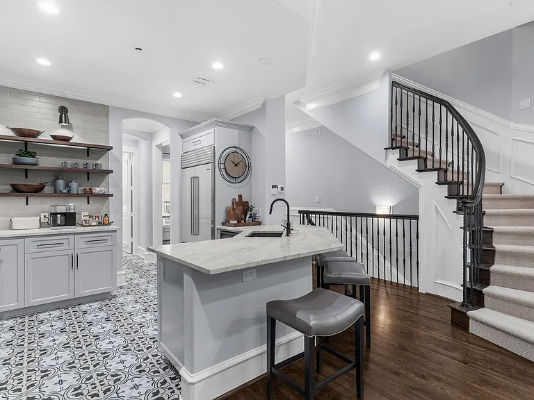 Custom tile work and high-end finishes throughout the kitchen.