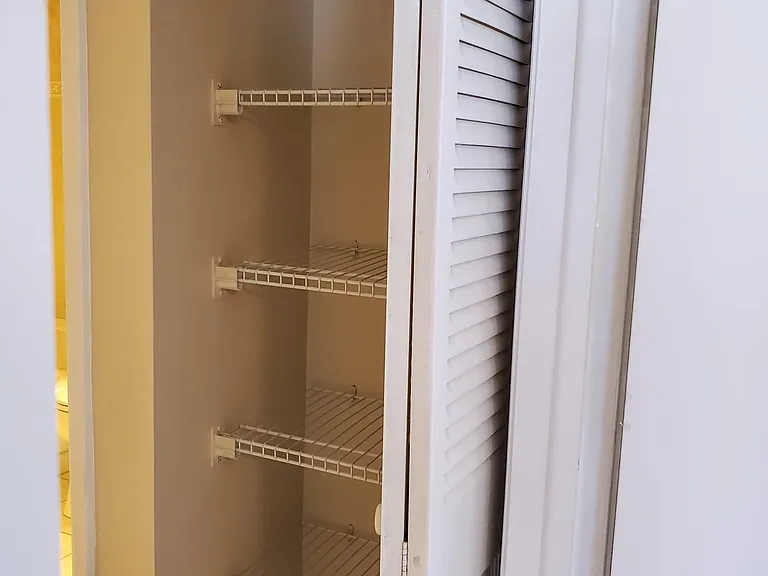Large hall closet with new wire shelving.