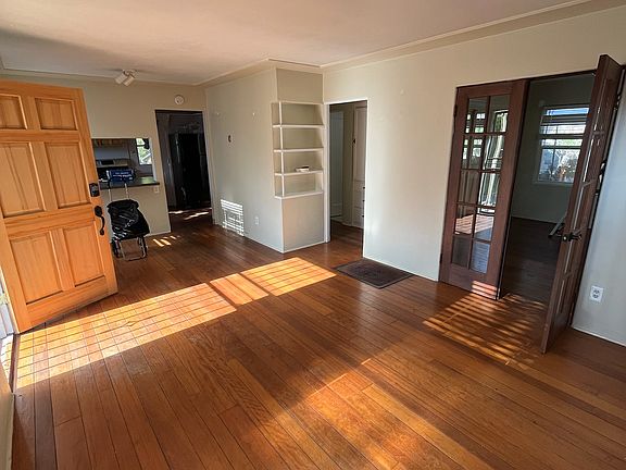 Front room with french doors leading to a bedroom.