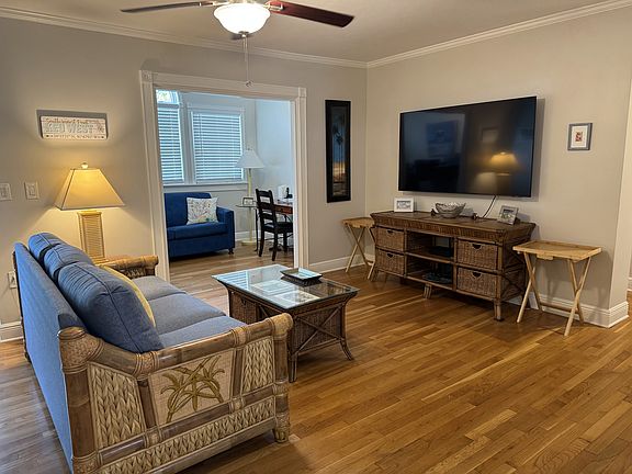 Spacious living room with large smart tv.
