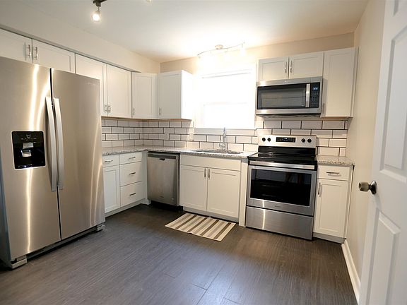 Bright modern kitchen with new stainless appliances