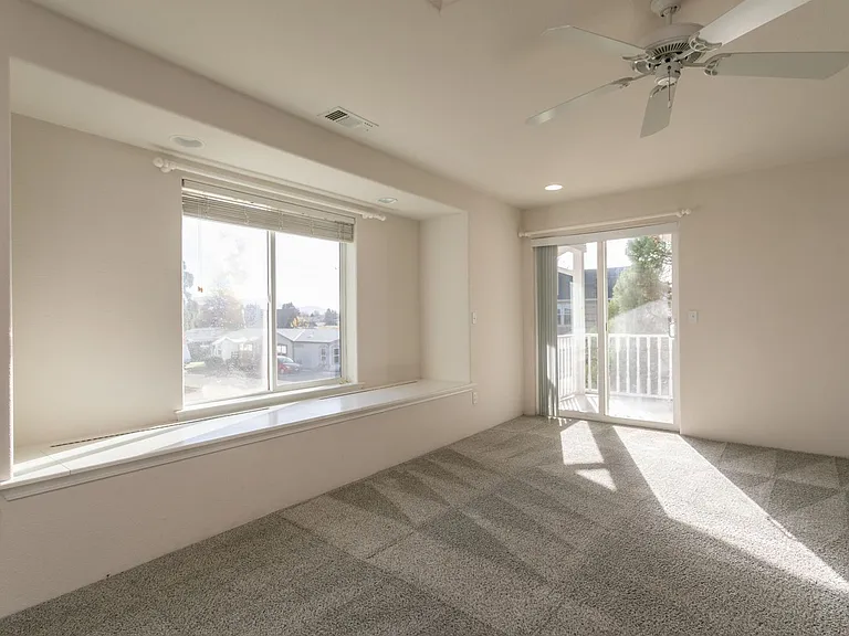 Master bedroom w/window bench & slider out to deck