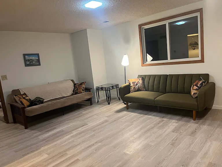 Large living room with wet bar and open fireplace.