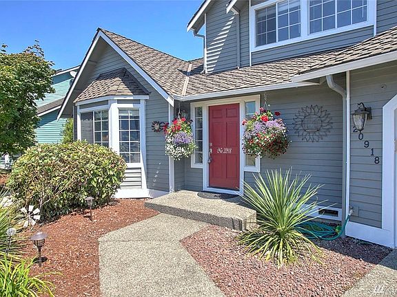 Boasts a newer 50-year Presidential roof, fresh exterior paint and Mature PNW landscaping.