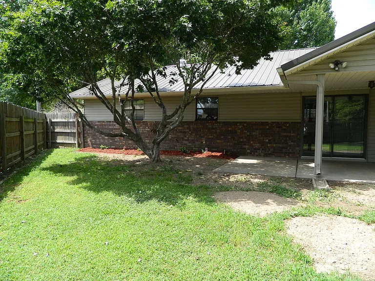 Back of house with cover patio