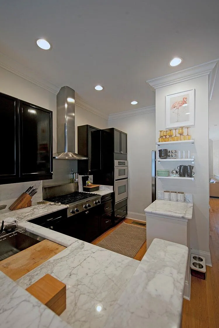 Kitchen with marble countertops and stainless steel applianc - 701 N Church St #4