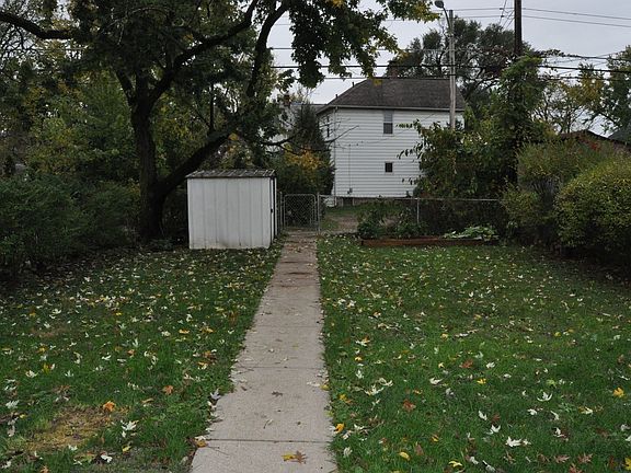 Enjoy the big, fenced back yard with raised garden bed and shed storage.