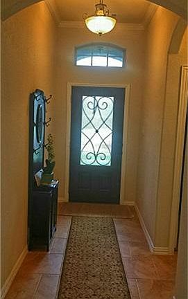 Front entrance with privacy glass door lets in the beginning of a new day.