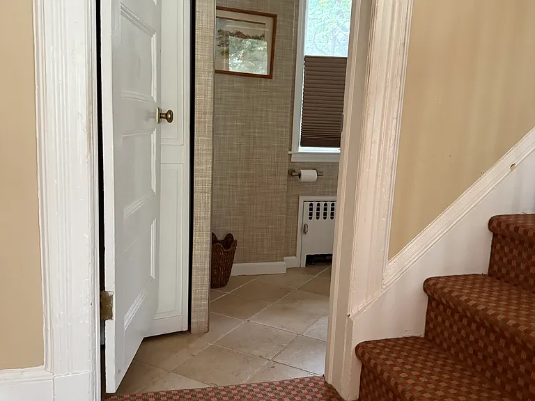 from foyer view into half bath