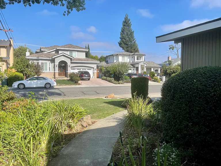 Walking down the path towards the front of the house