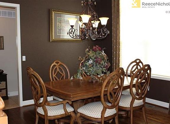 Hardwoods and large picture window in formal dining room.