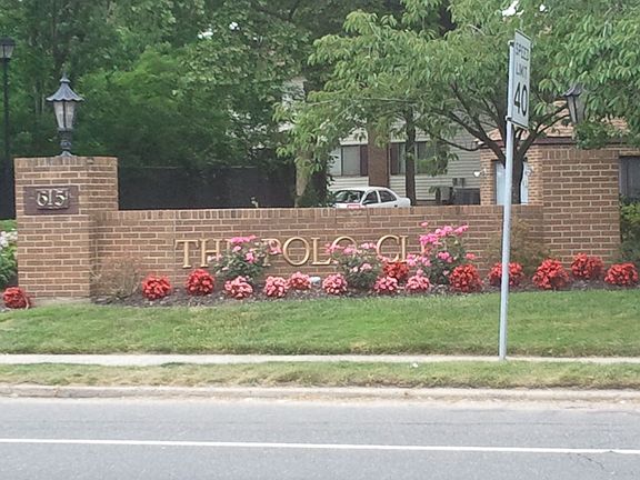 Polo Club sign near road