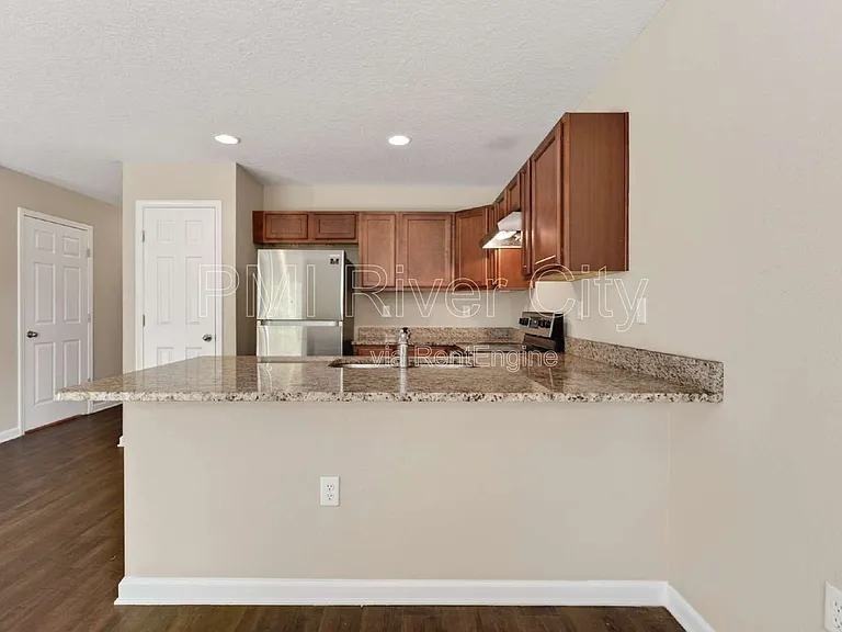 7608 Rain Forest Dr N — Photo 6