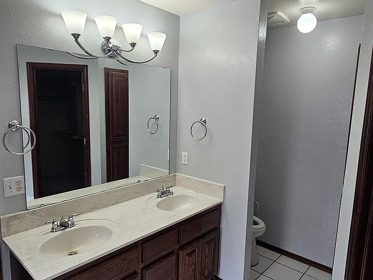 master bath double sink with toilet area. Super quiet high volume exhaust fan