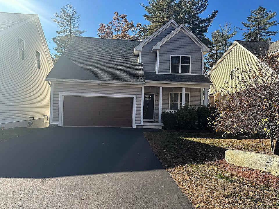 Front with large driveway for 4 additional guest cars.