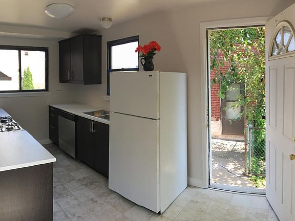 Updated kitchen with all new cabinets and countertops, new gas stove, new dishwasher. Door leads private outdoor space.