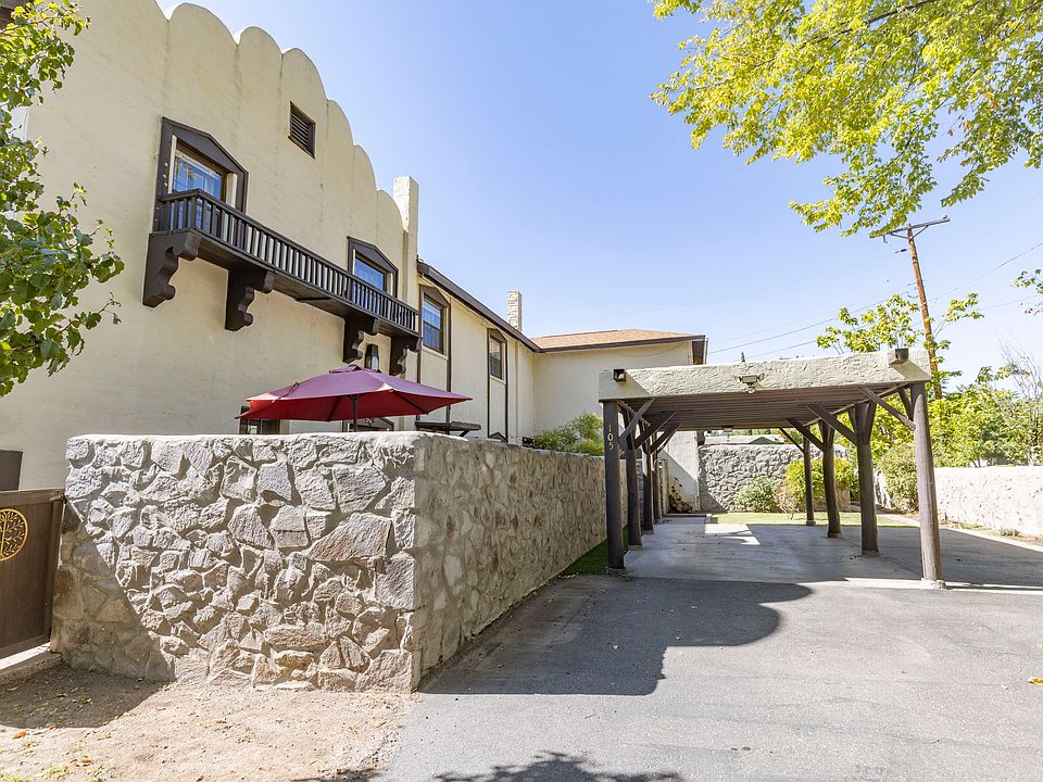 Charming historc property featuring private parking, beautiful green spaces, and beautifully appointed interior features.