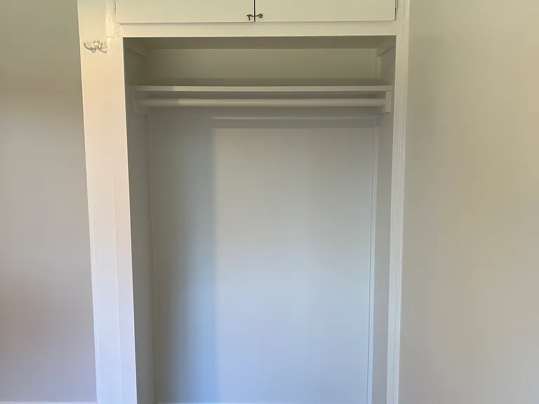 This is the bedroom closet. Deep storage above.