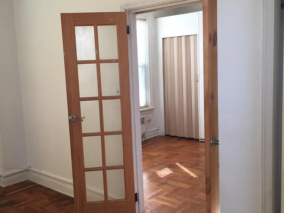view from opposite side of bedroom toward living room with