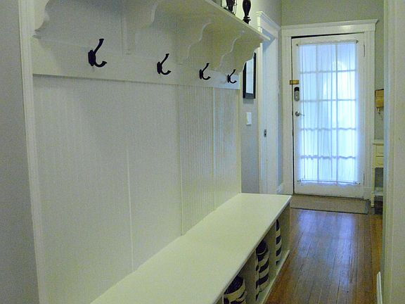 Entry way and hallway with custom built in storage