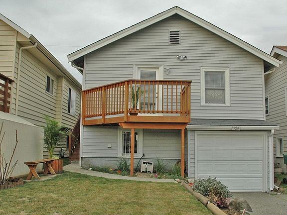 garage w/ auto door + parking pad for 4 cars!