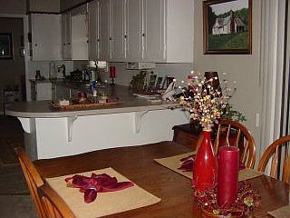 There's sliding glass doors off the cozy dining room that lead to the rear deck.