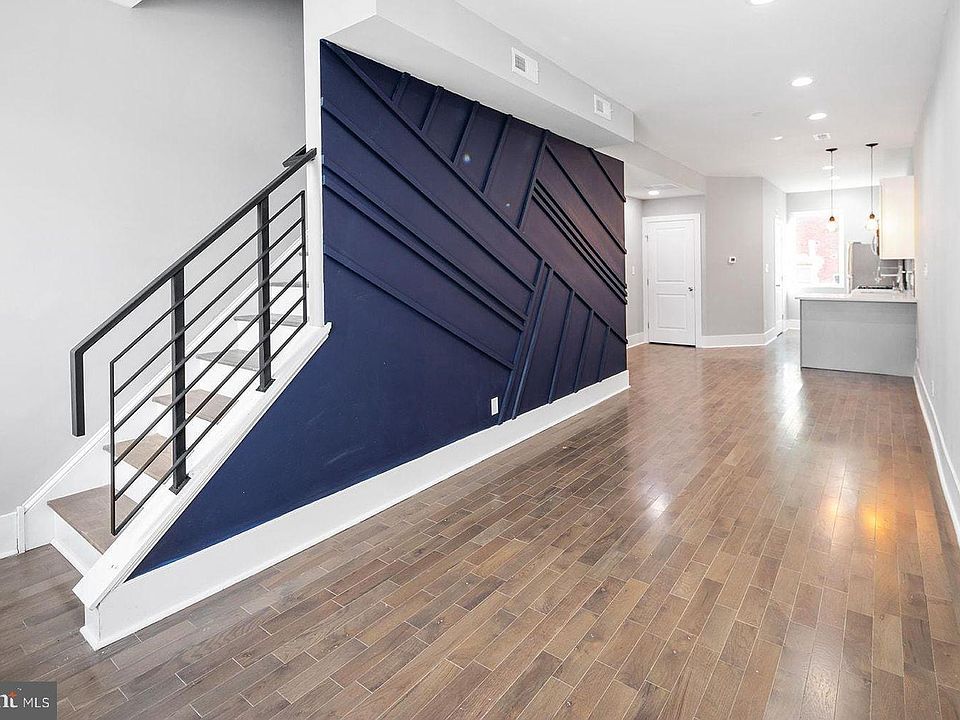 Living area (accent wall & open concept).