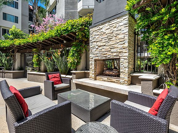 Outdoor fireplace with lounge seating.