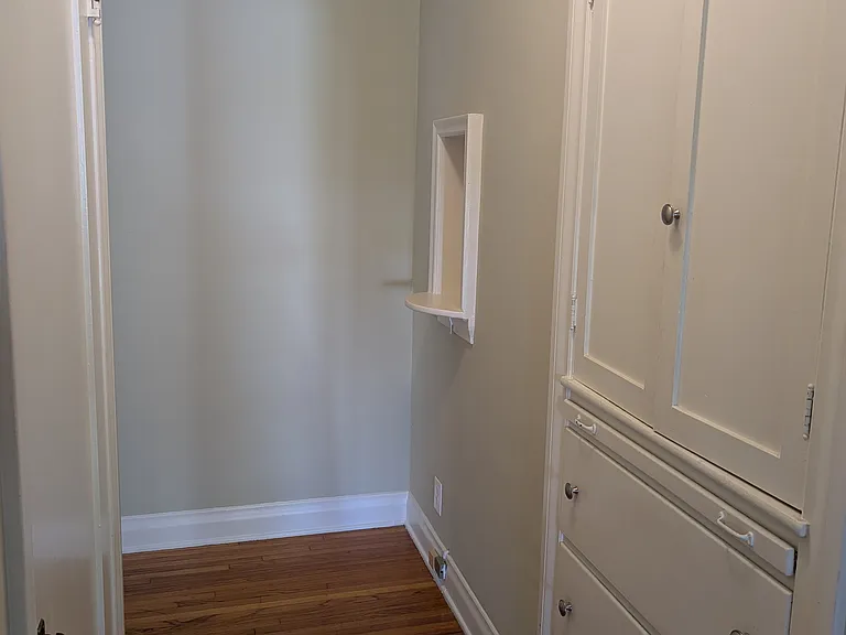 Coat Closet, large linen closet, and vintage telephone niche