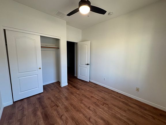 Downstairs bedroom (unfurnished). New wood plank flooring, spacious closet.