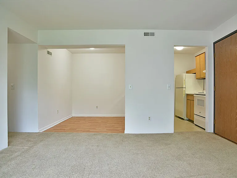 Kitchen, dining room, and living room at Charter Oak Apartments, Davison, Michigan