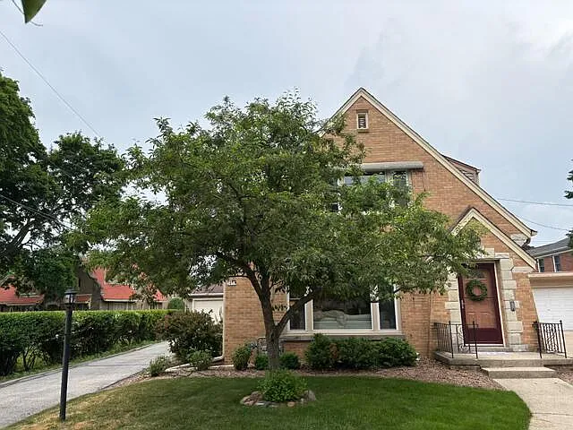 Front of duplex - the tree flowers in early spring