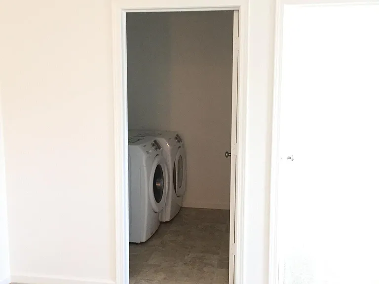 loft view of the laundry with high class Samsung washer and dryer.