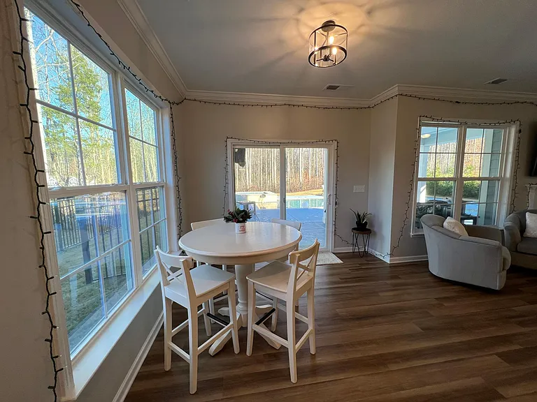 View of patio / pool and wooded lot