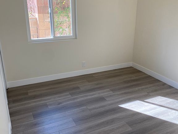 Bedroom with brand new flooring and windows