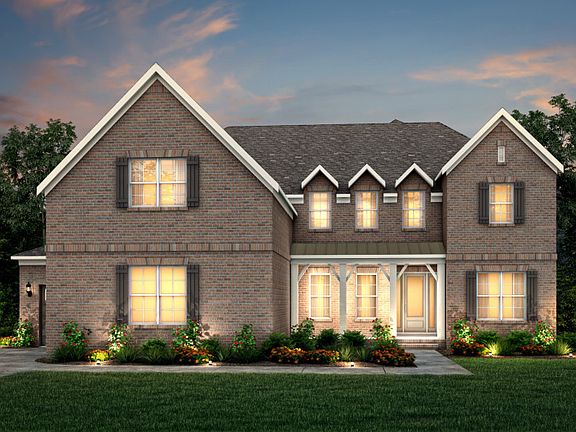 Sutton Exterior 15 features brick, covered front porch and 3 car sideload garage