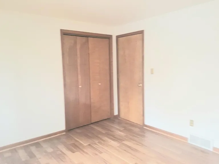 Upper bedroom has a double wardrobe clothes closet