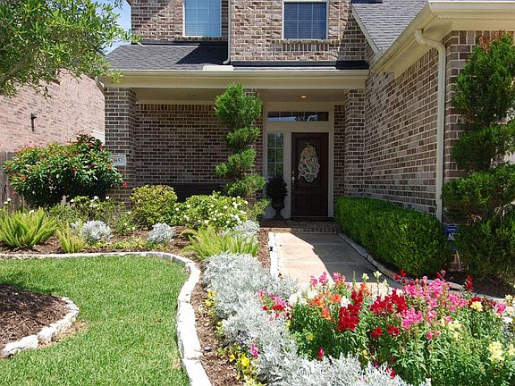 Luscious landscaping and a well manicured lawn in the front and back yard!  Sprinkler system and gutters around perimeter of the home.
