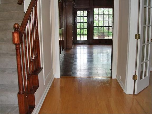  Wood flooring in entry. French doors on right lead to study.
