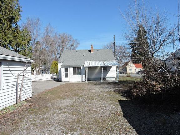 DISTANT BACK AREA VIEW OF HOUSE, GARAGE & WORK