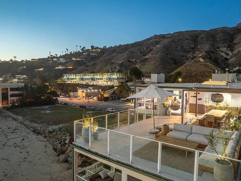 Unwind on the deck in the evening, where coastal breezes meet starlit skies.