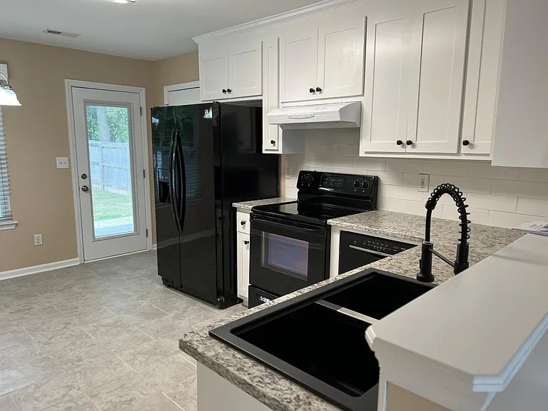 Kitchen with new granite and tile flooring