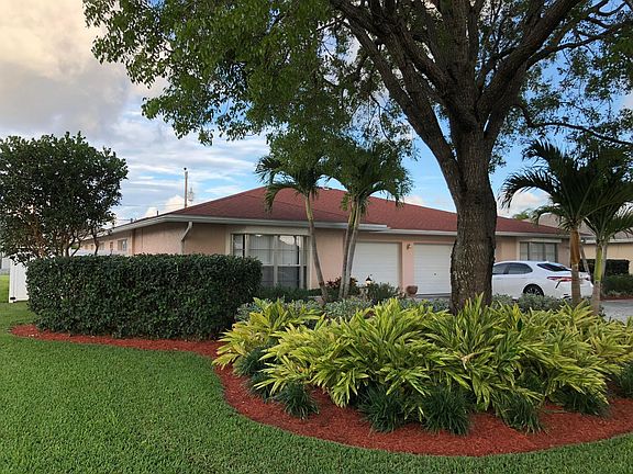 Well maintained lawn and landscaping with sprinkler system on city dual water.