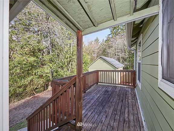 Rear deck of home looking out to the back yard. 